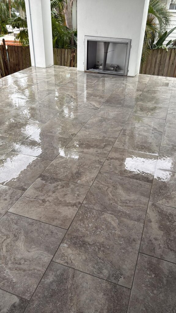 Dark porcelain pavers entrance and driveway installation — Florida outdoor flooring Orlando Tampa Sarasota Bradenton