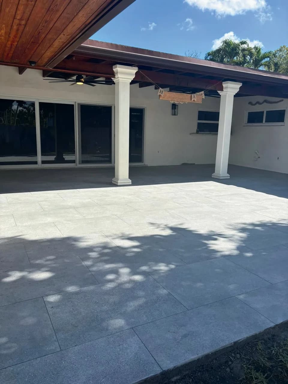 Antico Grigio porcelain pavers installed on a Florida outdoor living space by EC Paver Solutions