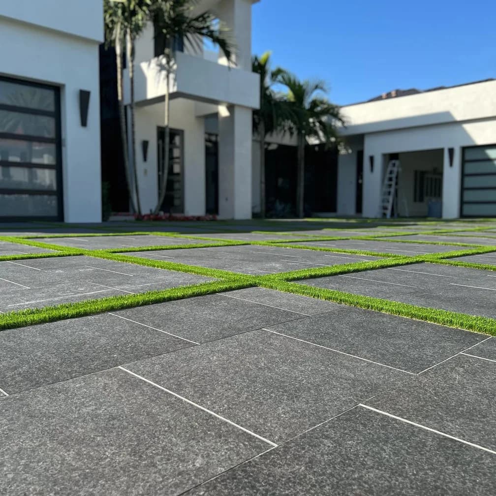 Basalt porcelain pavers installed on a Florida pool deck by EC Paver Solutions
