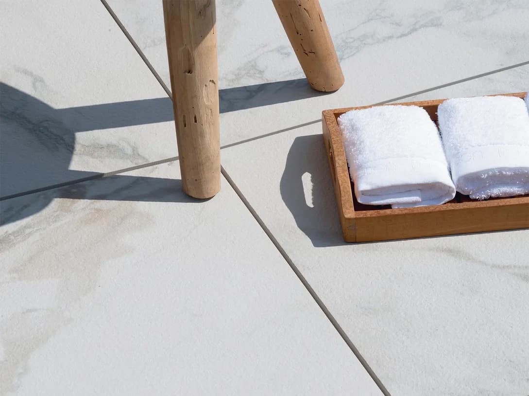 Calacatta porcelain pavers installed on a Florida pool deck by EC Paver Solutions