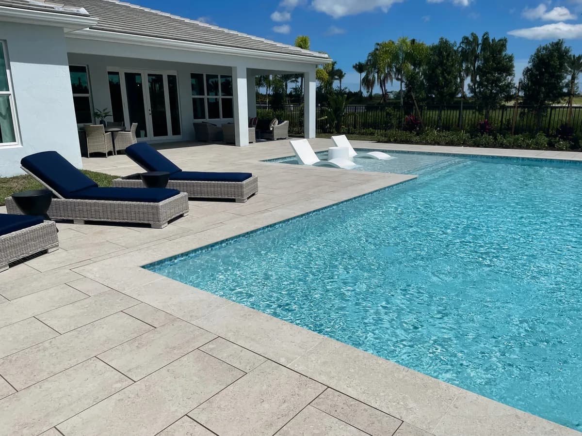 Coraline Grey & Ivory porcelain pavers installed on a Florida outdoor living space by EC Paver Solutions