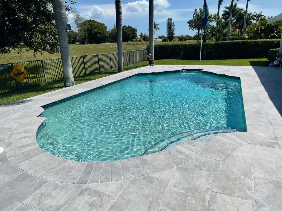 French Limestone porcelain pavers installed on a Florida outdoor living space by EC Paver Solutions