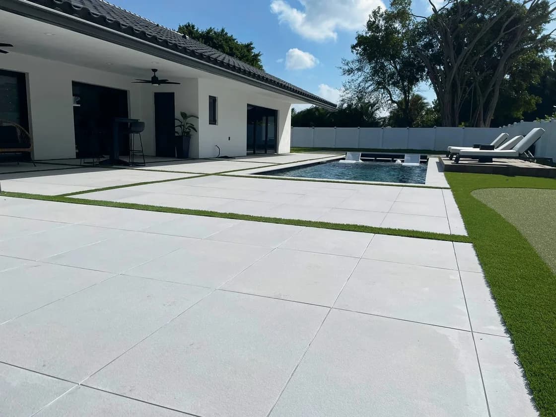 Light Grey porcelain pavers installed on a Florida pool deck by EC Paver Solutions