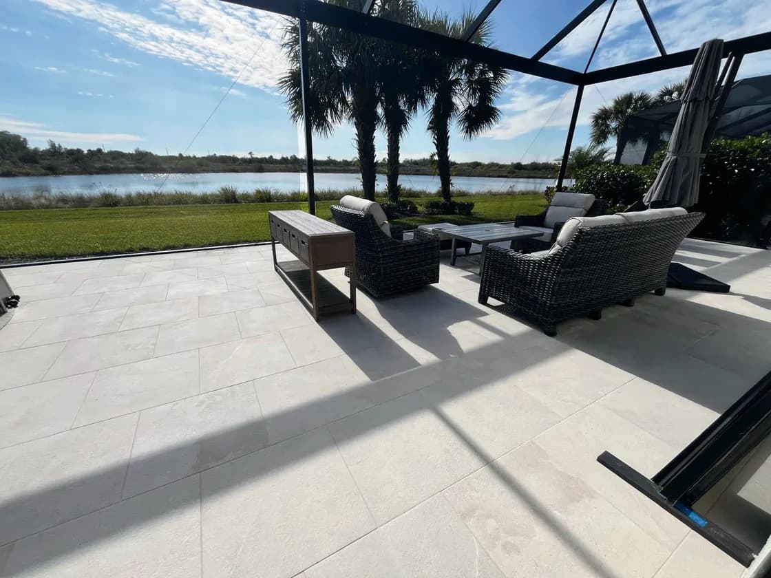 Pietra Reale Crema porcelain pavers installed on a Florida pool deck by EC Paver Solutions