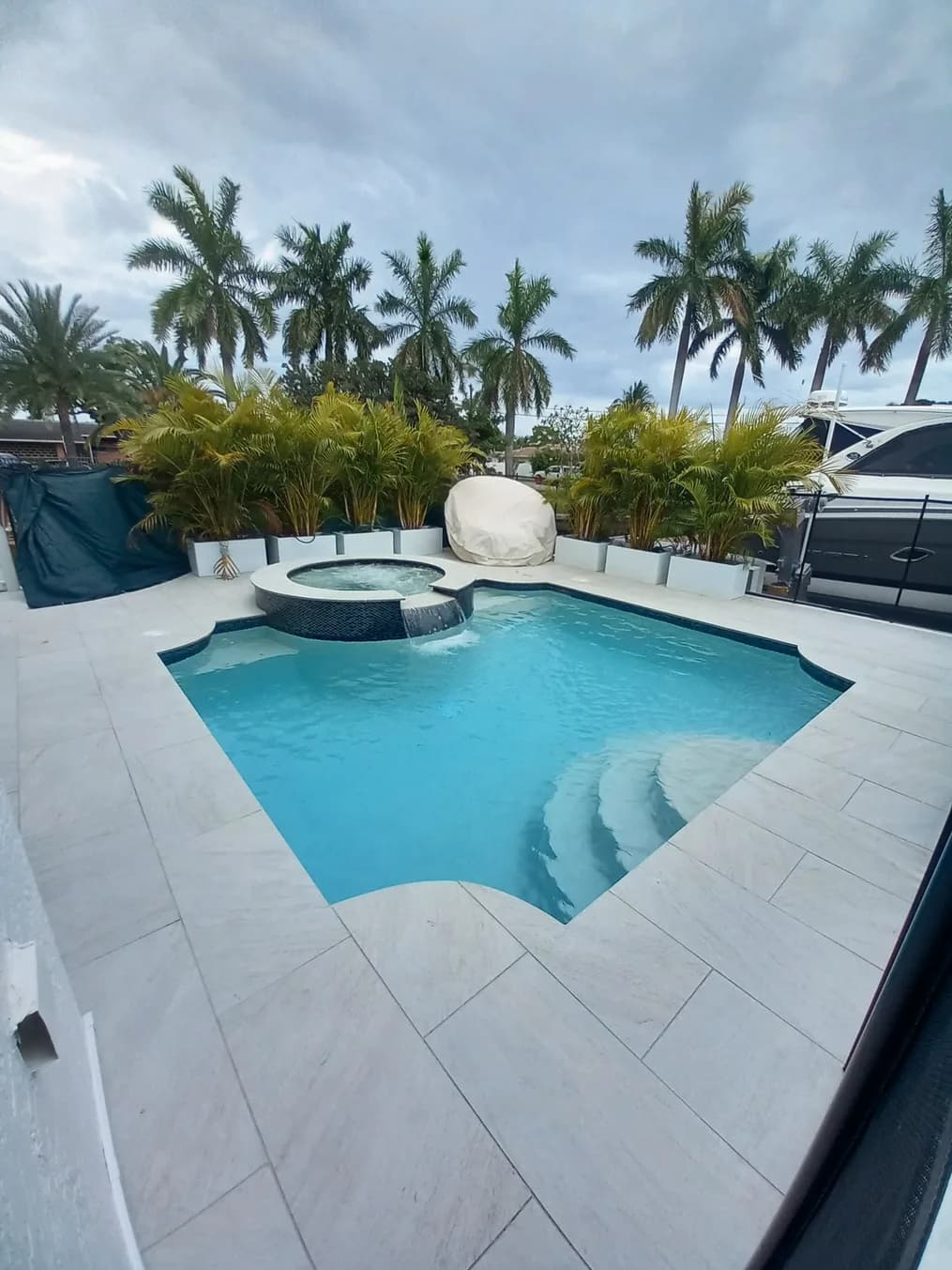 Quartz Bianco porcelain pavers installed on a Florida pool deck by EC Paver Solutions