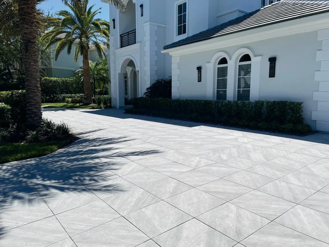 Quartz Griss porcelain pavers installed on a Florida pool deck by EC Paver Solutions
