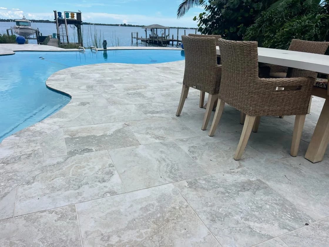 Roma Travertine porcelain pavers installed on a Florida pool deck by EC Paver Solutions