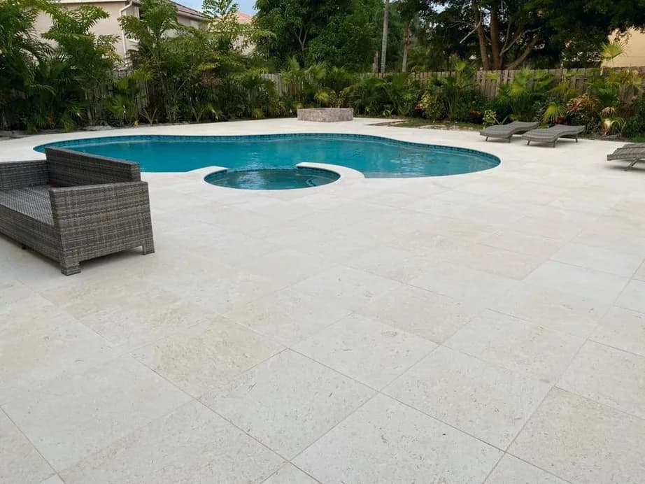 Shellstone porcelain pavers installed on a Florida pool deck by EC Paver Solutions