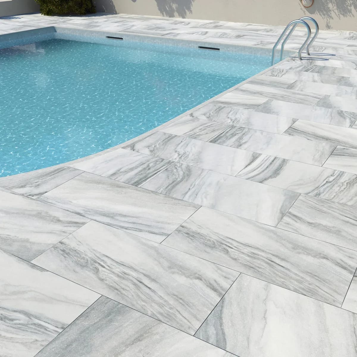 Silver White porcelain pavers installed on a Florida pool deck by EC Paver Solutions