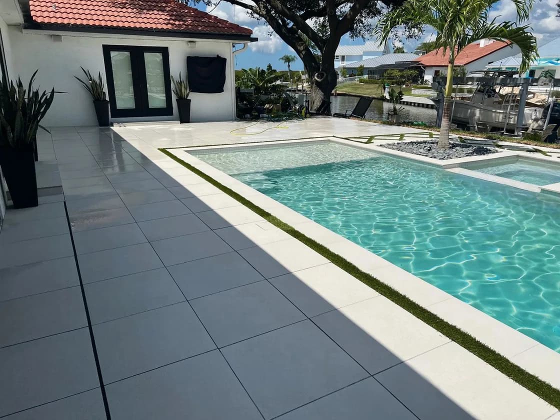 Snow White porcelain pavers installed on a Florida pool deck by EC Paver Solutions