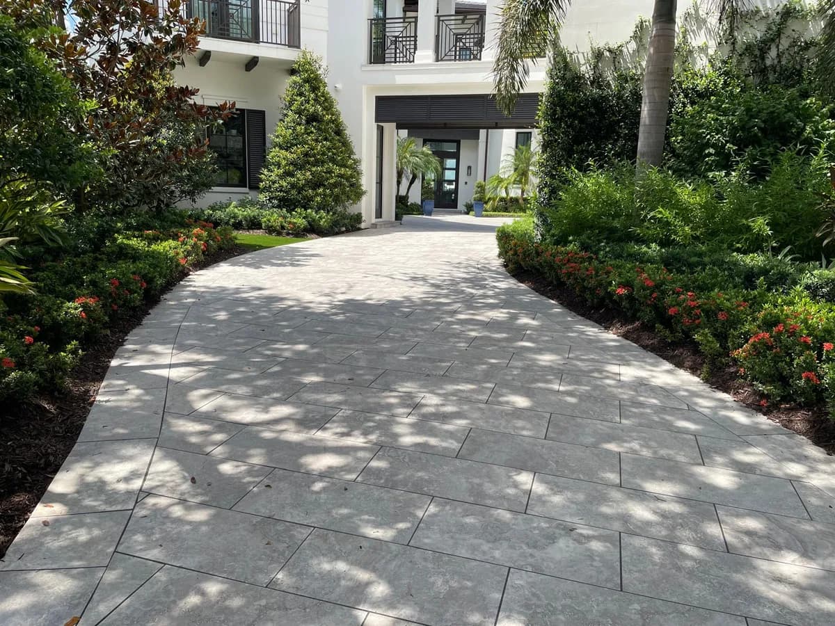 The finished driveway: right base, right thickness, right pattern, anchored edges — specified in writing.