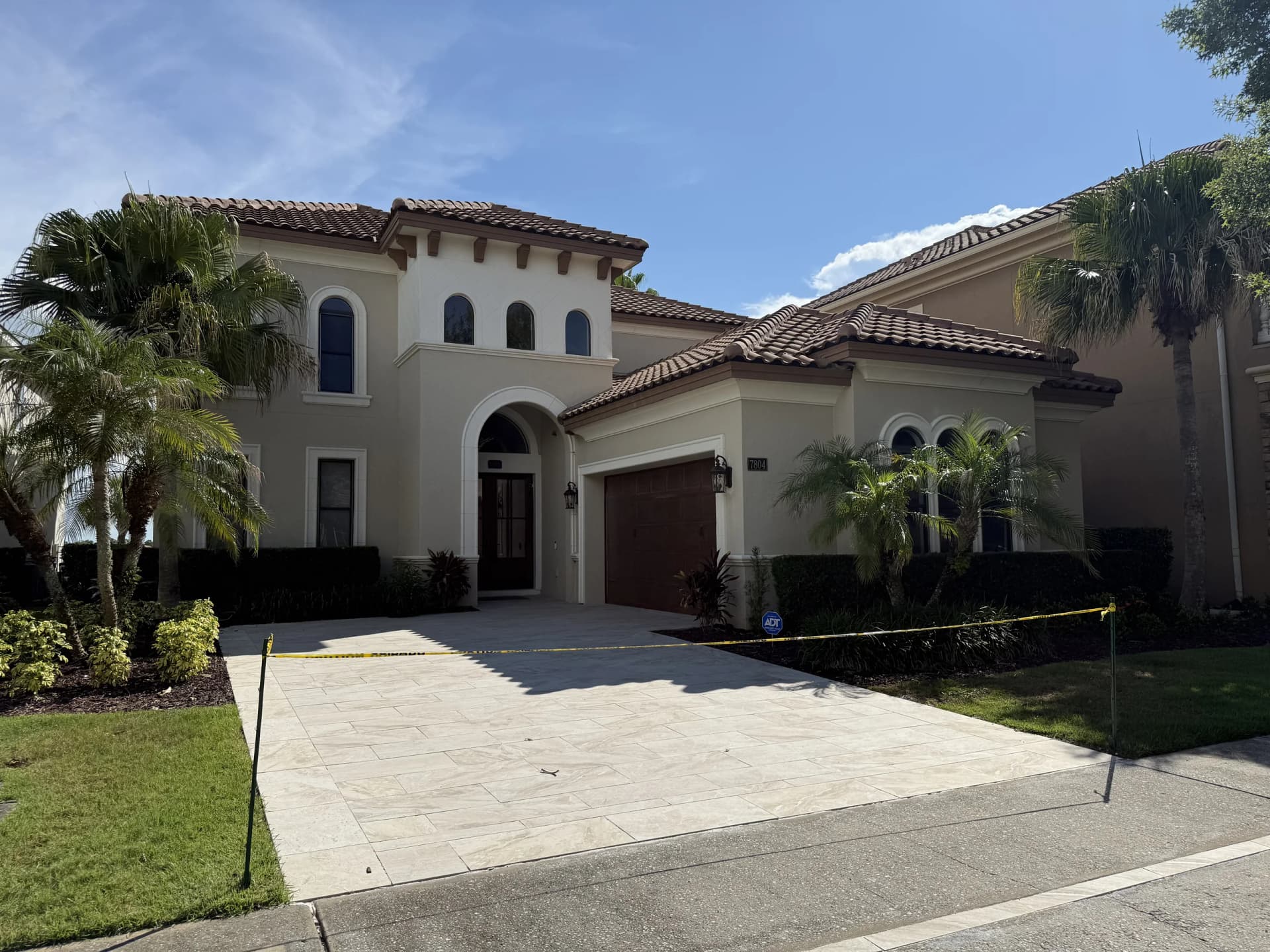 Paver driveway and front walkway at a Mediterranean-style home in Florida