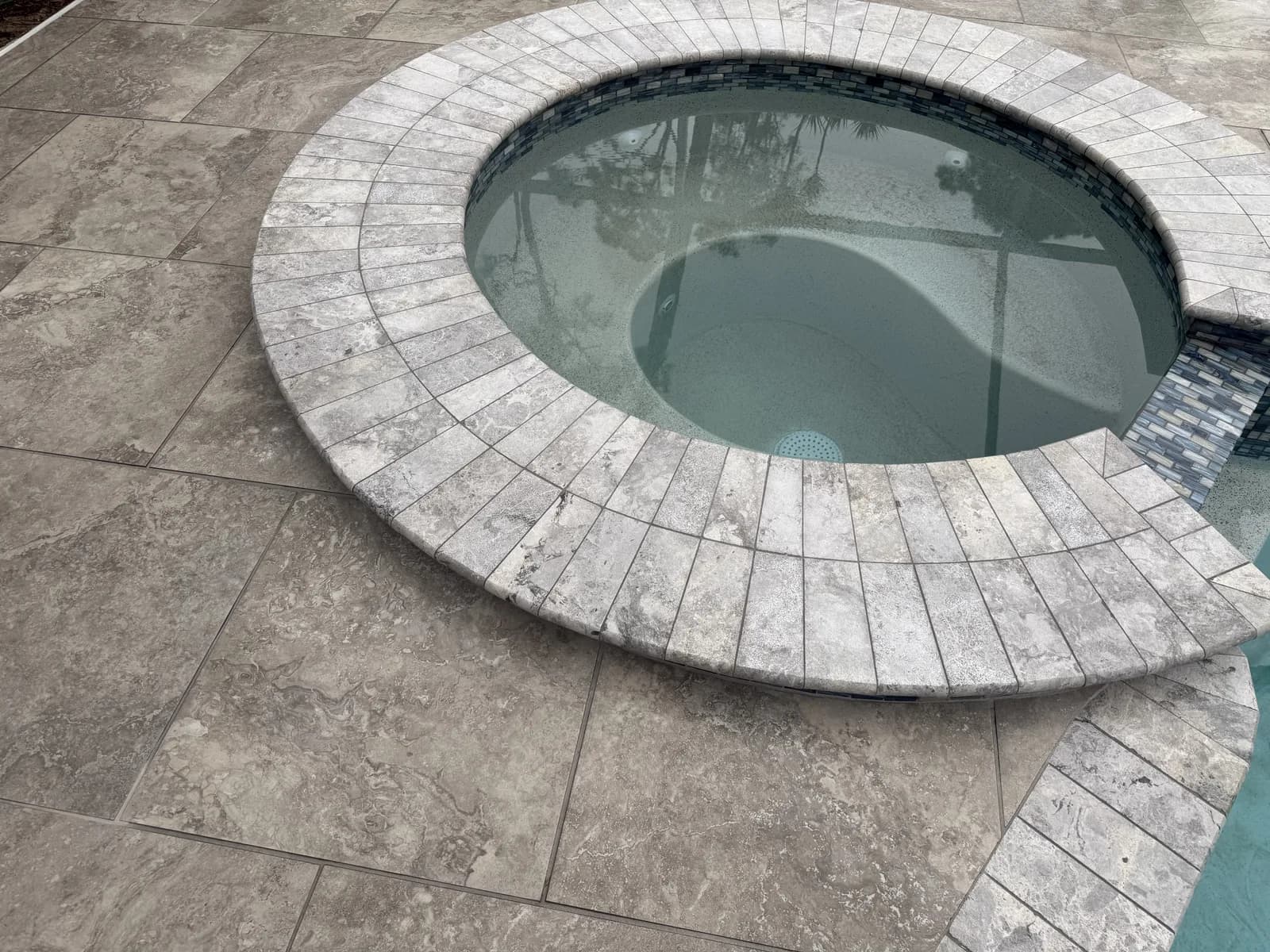 Radial cuts around a spa. This is where an installer either has the training or improvises — and improvisation is visible forever.